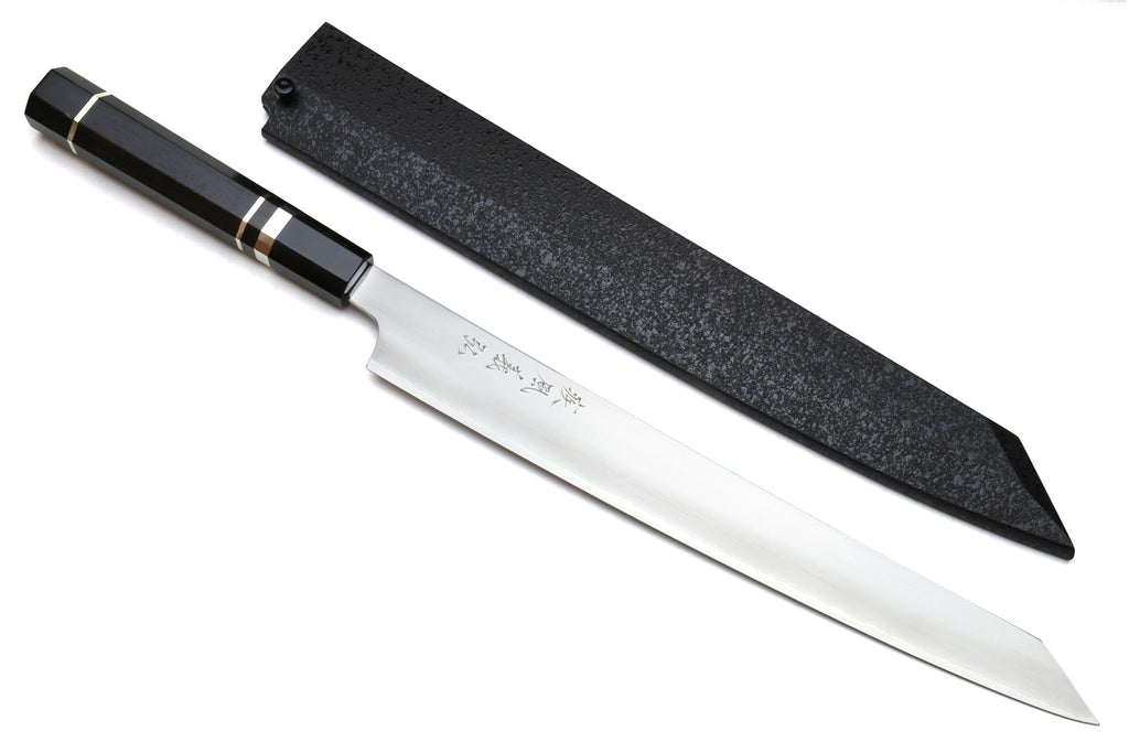 Kiritsuke slicer knife with white blade, dark ebony handle, and black sheath