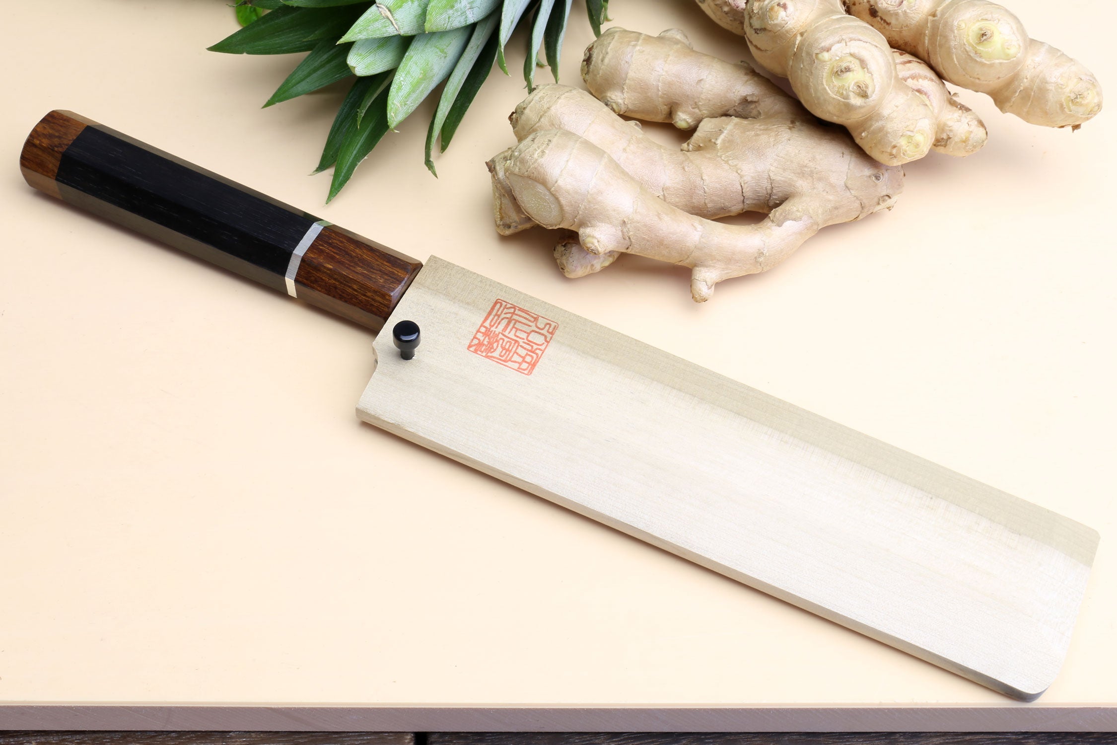 Ebony-handled Japanese vegetable knife with silver bolster and polished blade