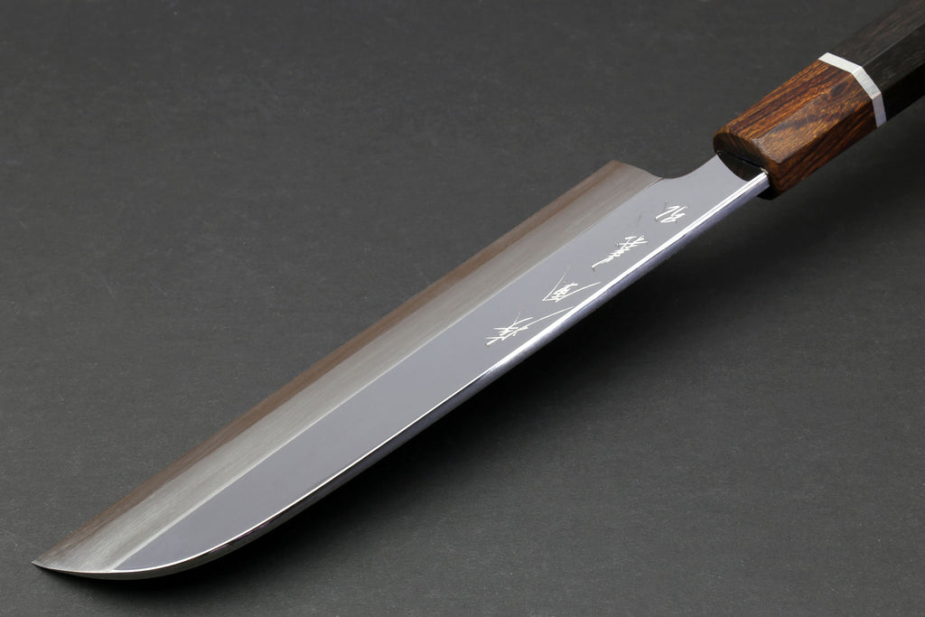 Japanese chef knife side view with mirror-polished blade and ebony handle