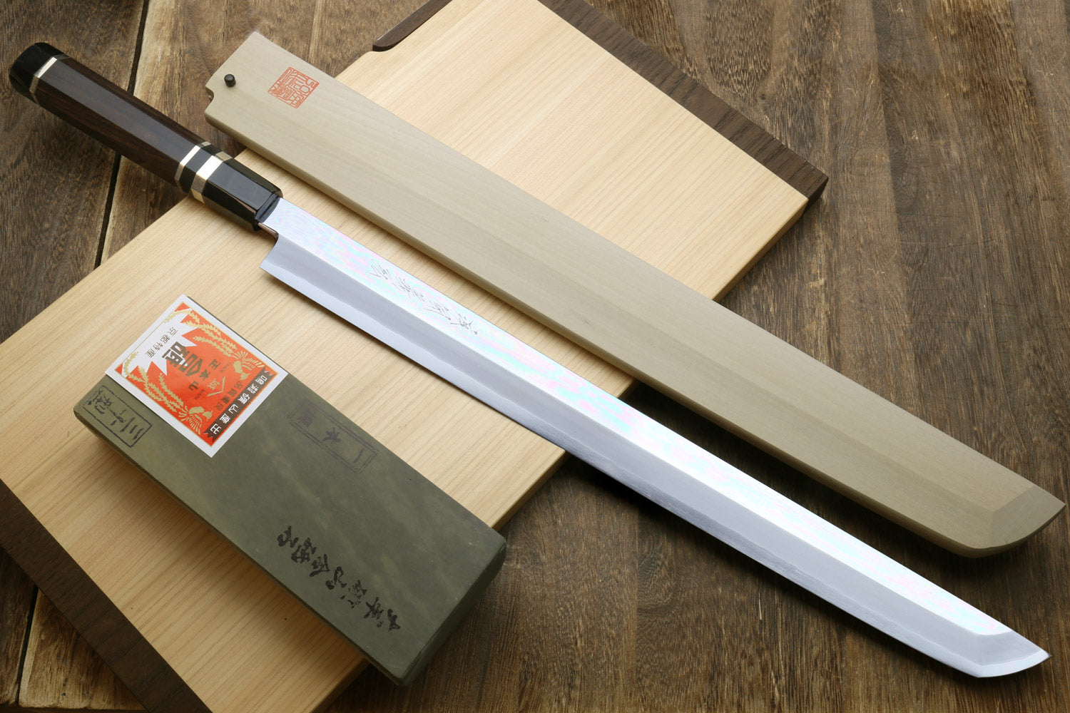 Mirror-polished stainless tuna knife with ebony handle and triple silver rings