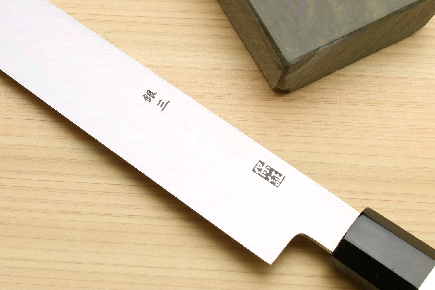 Tuna knife blade with etched label and dark ebony handle with silver cap