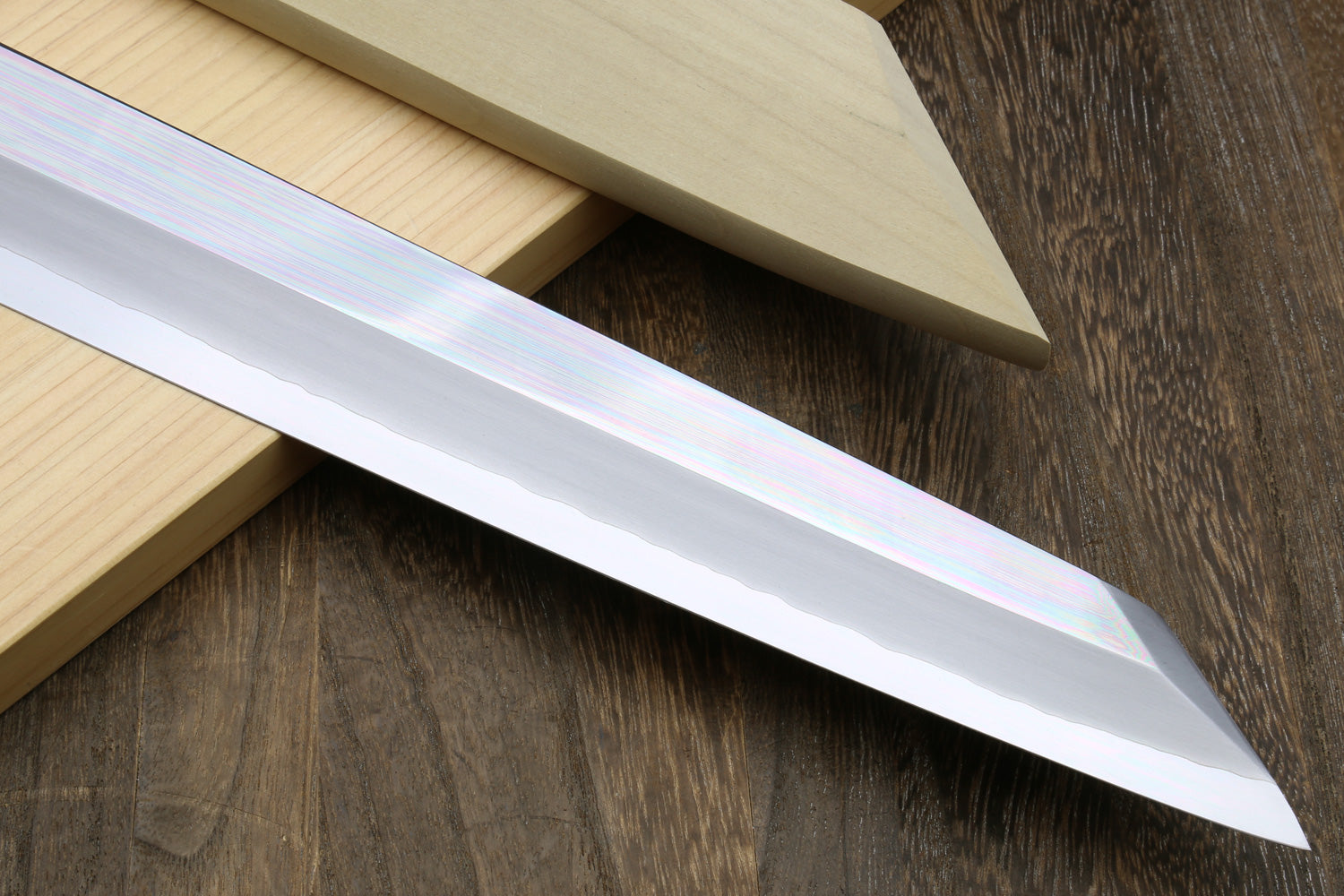 Mirror-polished steel tuna knife blade with sharp edge and reflective finish