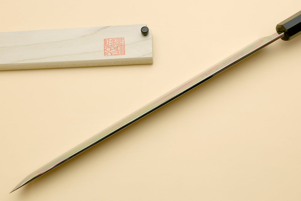 Japanese slicing knife with long, pointed mirror-polished blade and ebony handle