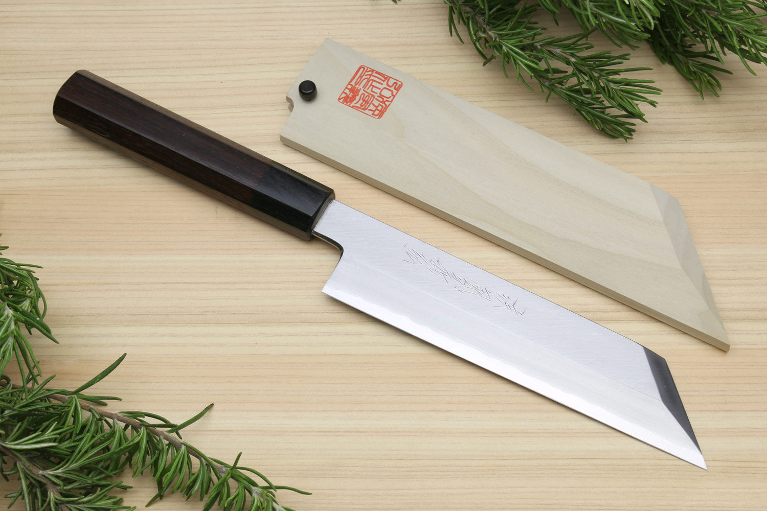 Single-edged vegetable knife with dark handle and white blade