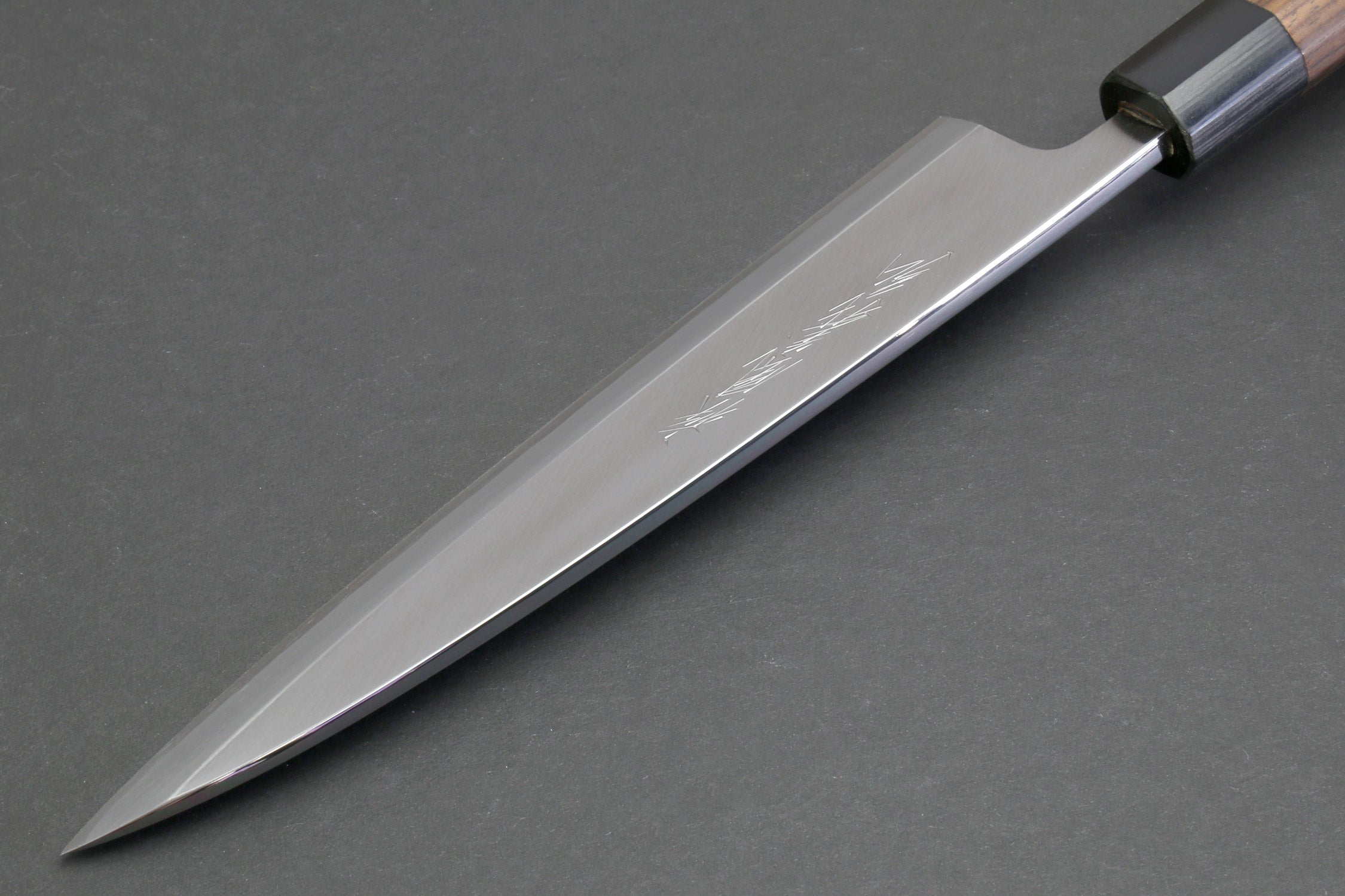 Japanese filet knife with brushed steel blade and dark handle