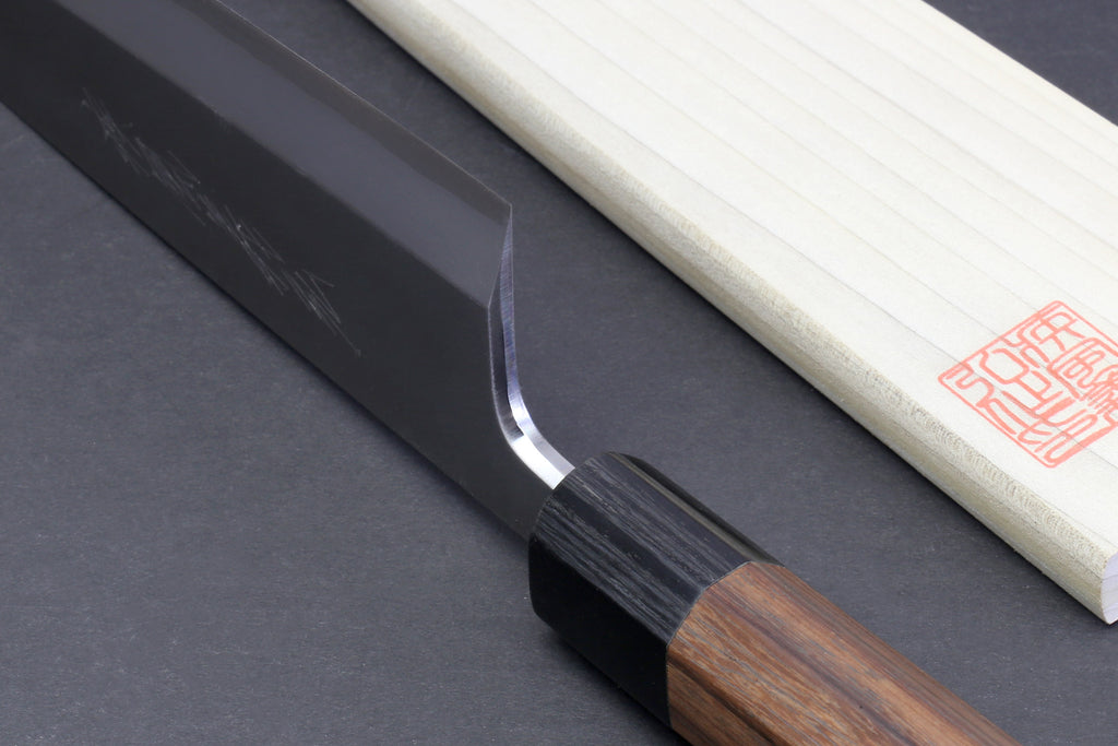 Japanese filet knife pair with dark blade and light handle, single edge