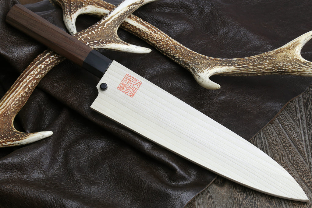 Japanese single-edged filet knife with wooden handle and pale blade