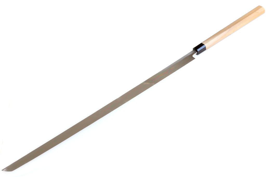 Single-edged tuna knife showing full blade length and light wood handle