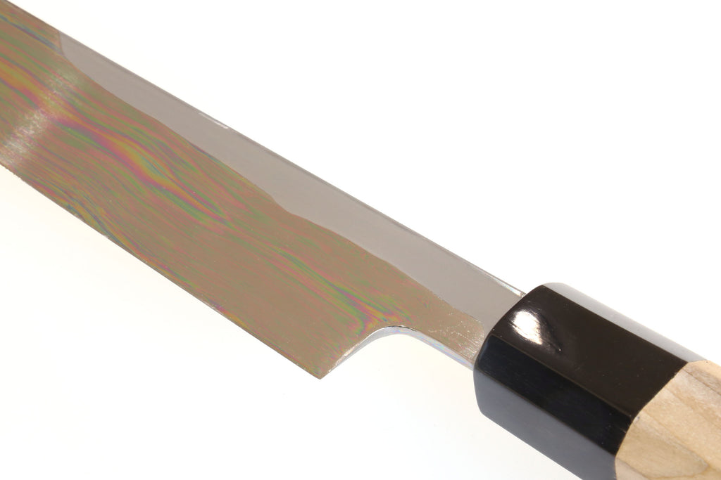 Tuna knife blade near tip with black ferrule and light wood handle