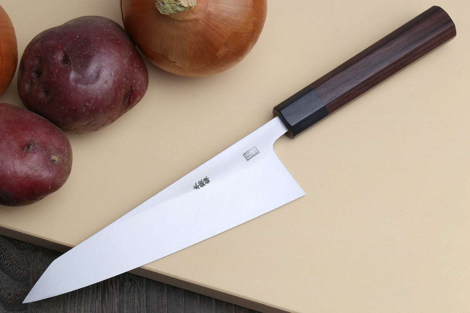 Traditional Japanese garasuki boning knife with slim blue steel blade and dark rosewood handle