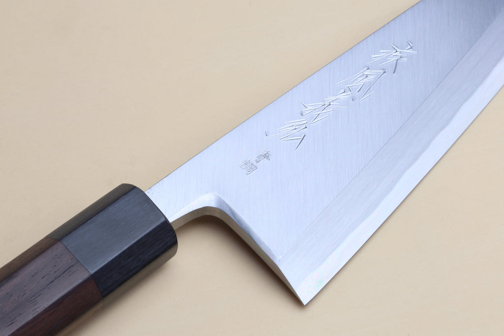 Traditional Japanese garasuki boning knife with engraved blade and dark rosewood handle