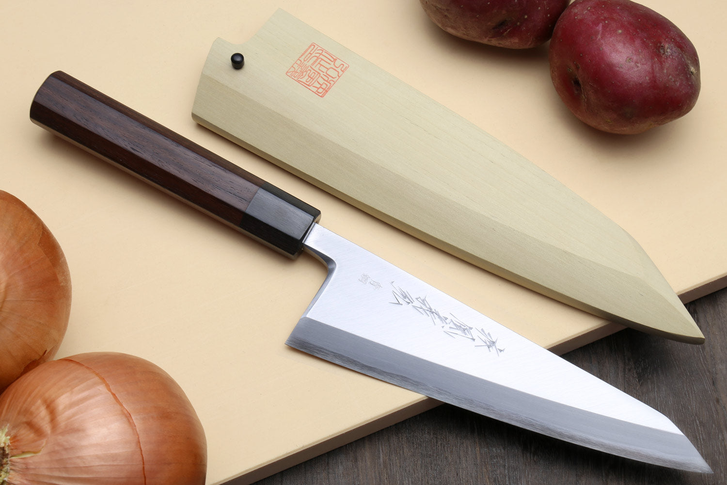 Traditional Japanese garasuki boning knife with blue steel blade and dark rosewood grip