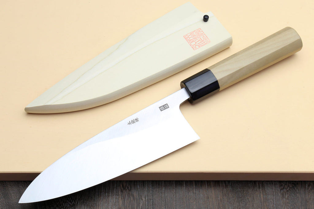 Deba chef knife with white sheath and white blade, light wood handle and black bolster
