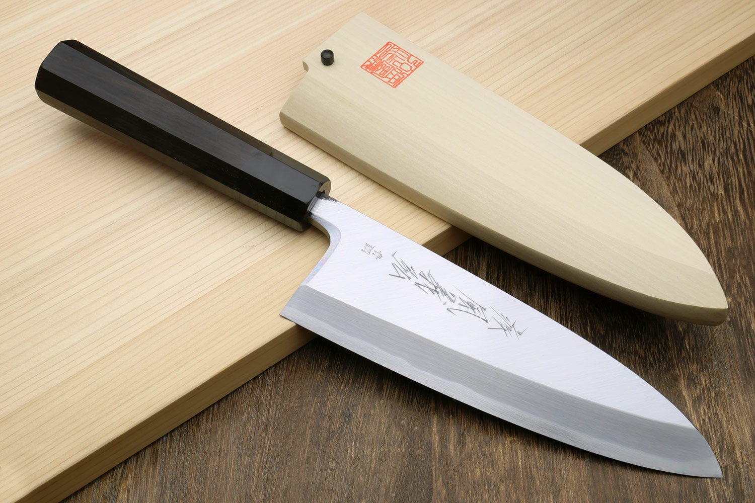Deba fish fillet chef knife with silver blade and ebony handle in light wood case