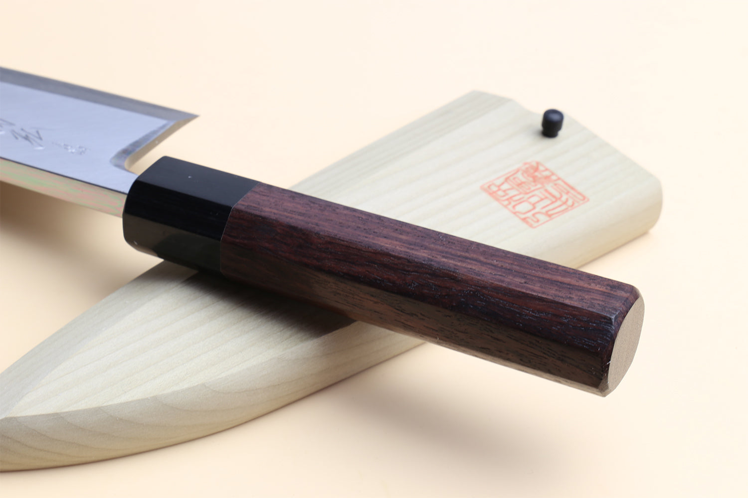 Deba fish fillet chef knife, dark shitan handle and light steel blade, side angle