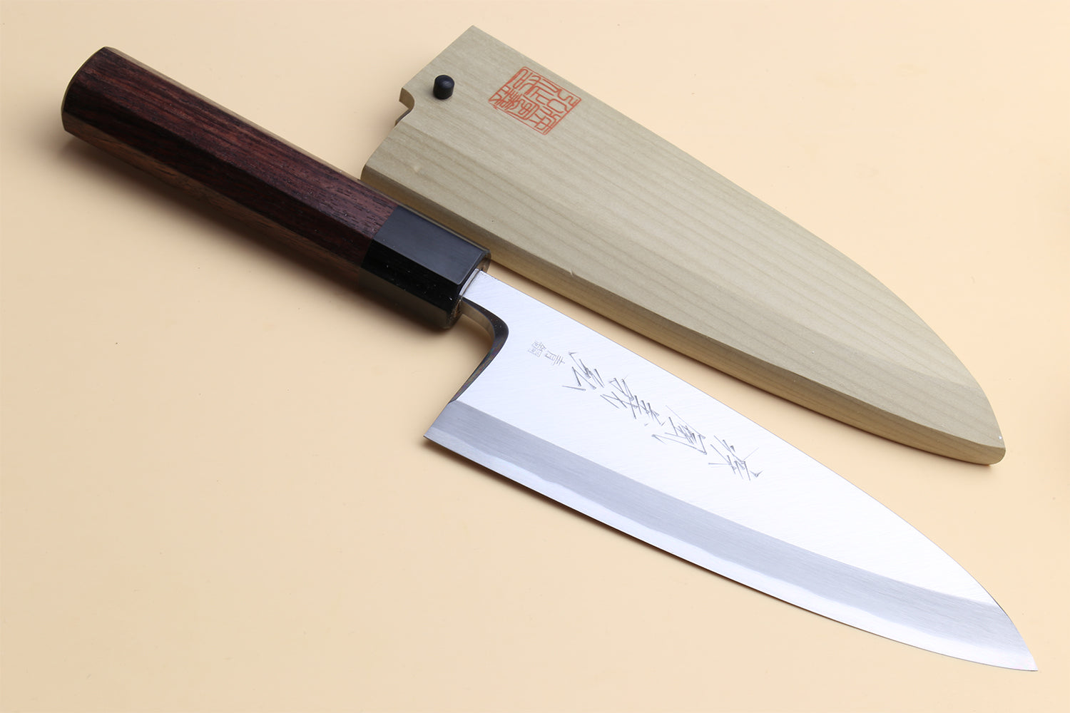 Deba fish fillet chef knife, light steel blade, dark shitan handle, side view