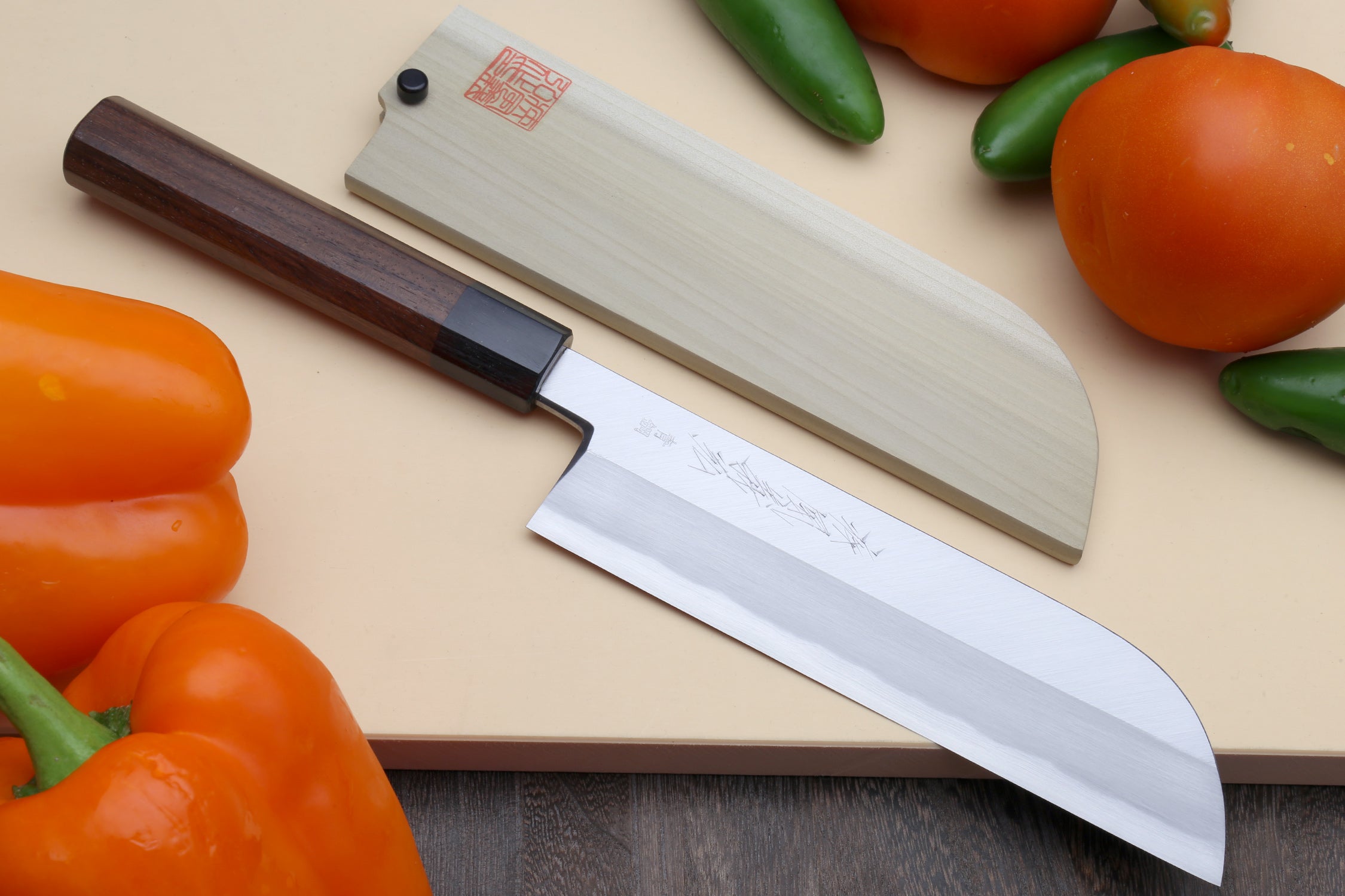 Traditional Japanese vegetable chef knife with blue steel blade and rosewood handle