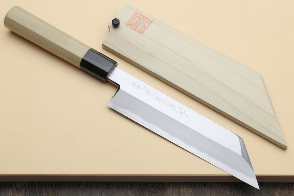 Japanese chef knife with light wooden handle and dark collar, polished steel blade