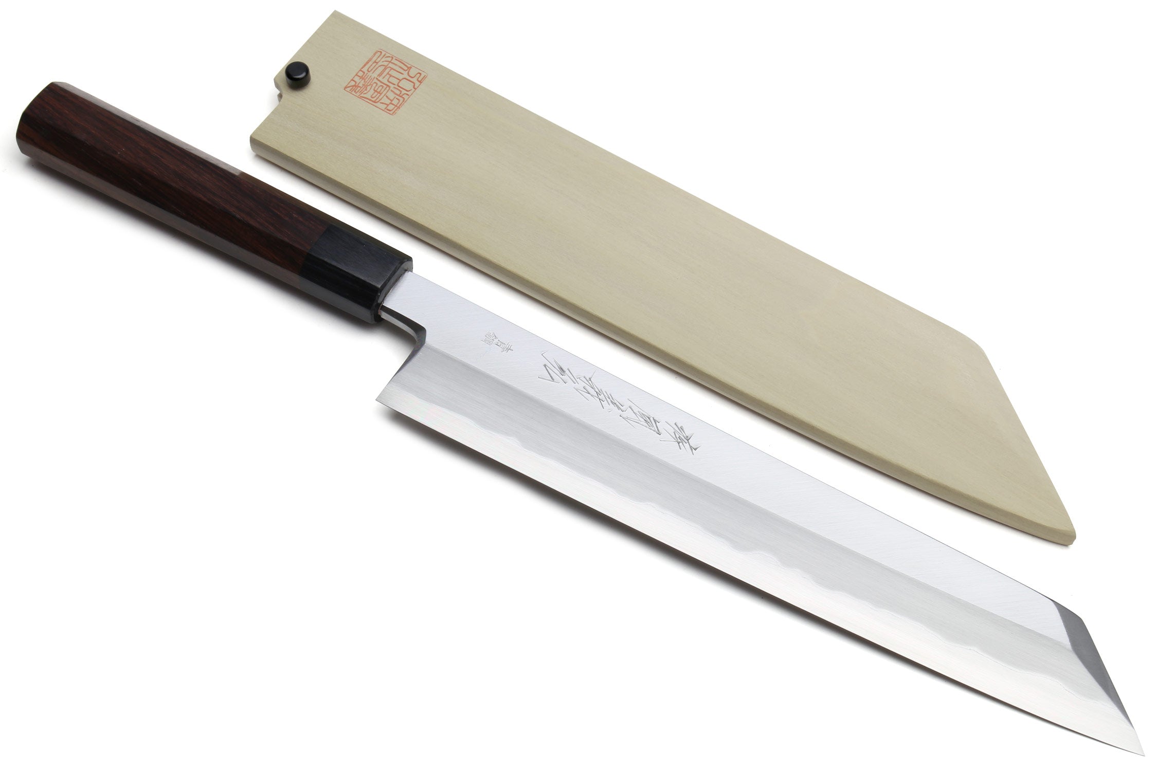 Japanese chef knife with pale blade and saya, set on white background