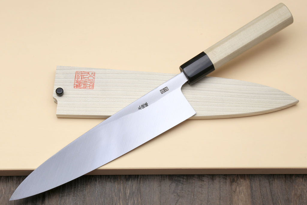 Japanese sashimi knife with wide silver blade and light wood handle, black collar