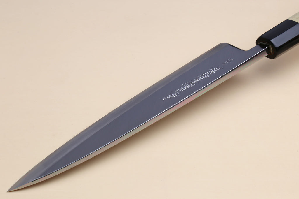Japanese sashimi knife with dark blue blade and black handle collar