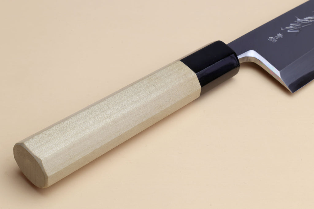 Japanese filet knife with light wood handle and dark blade, black collar