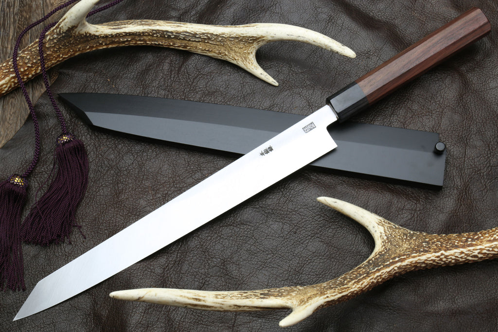 Japanese yanagi-kiritsuke sushi knife showing long blade and rosewood handle