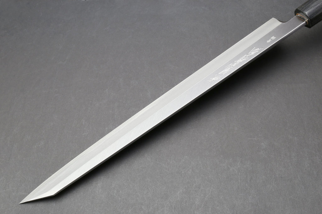 Japanese yanagi knife with long tapered blade and rosewood handle