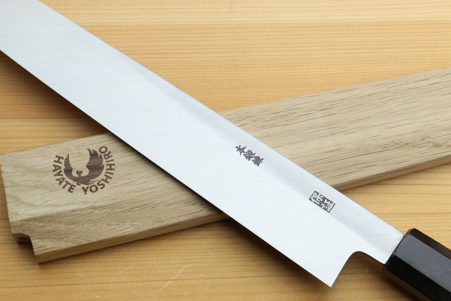 Japanese sashimi knife with stamped blade side marks, silver steel and magnolia handle