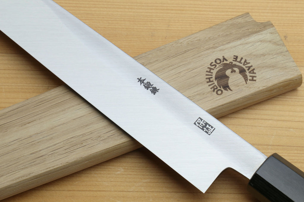 Sashimi knife blade detail with etched markings and rosewood handle