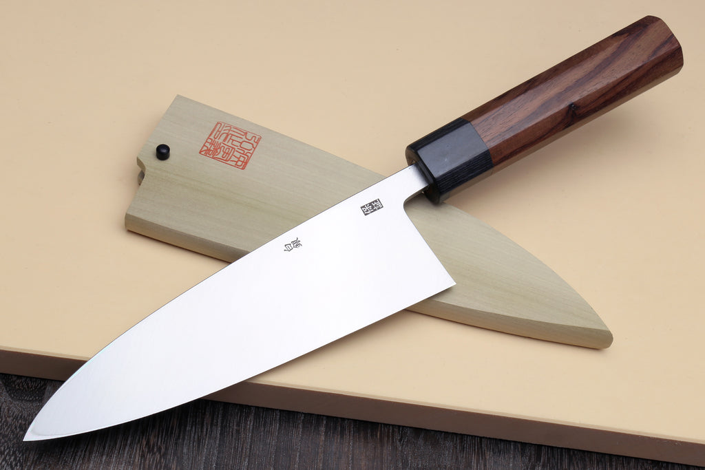 Deba fish fillet knife side view, white blade with dark bolster and rosewood handle