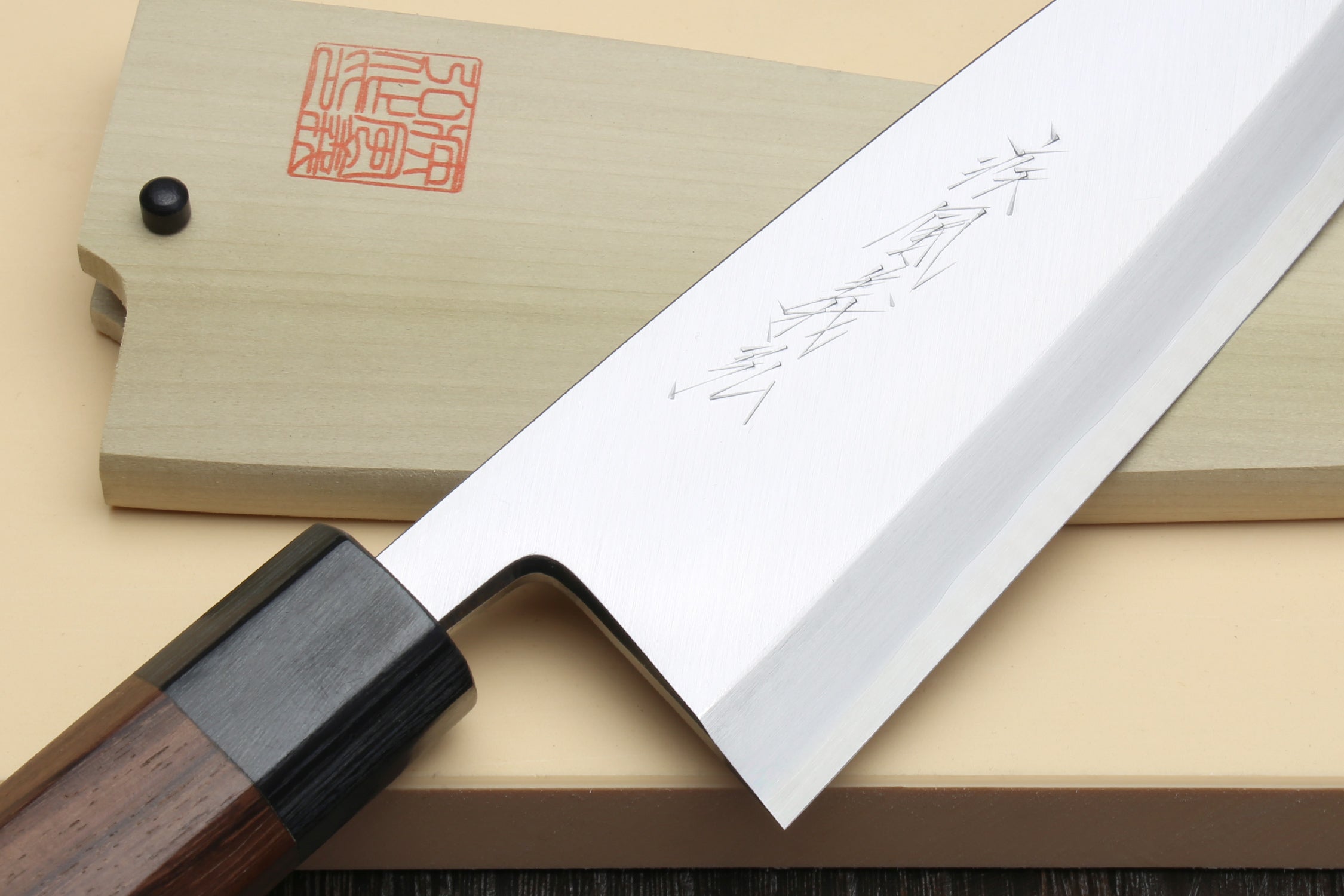 Deba fish fillet knife detail view, white blade with fine etching and rosewood handle