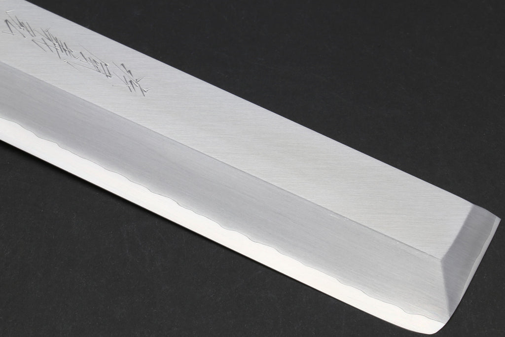 Japanese chef knife blade edge close-up with pale polished finish