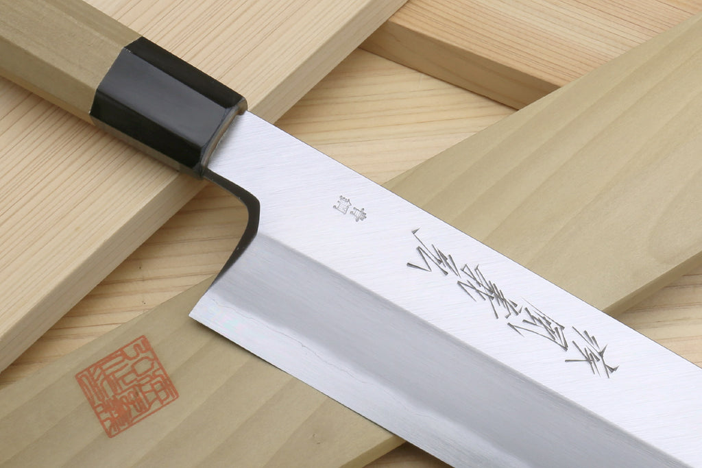 Japanese eel bone slicer knife with engraved silver blade and black handle collar