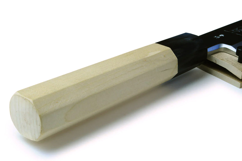 Japanese eel bone slicer knife handle end with light wood grip and black bolster