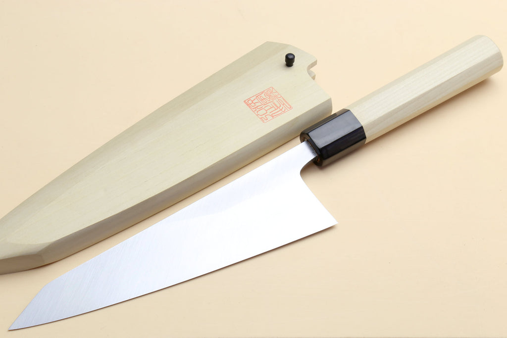 Japanese boning knife angled view, light wood handle, dark grip collar, sharp tip