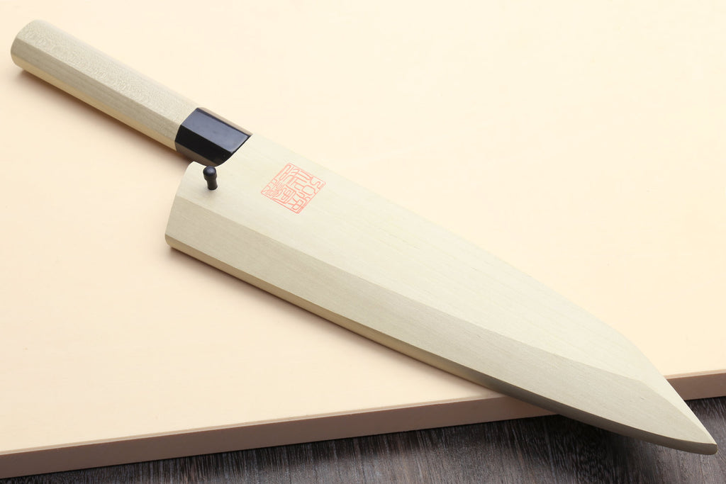Traditional Japanese poultry boning knife, light magnolia handle with black collar, pointed tip