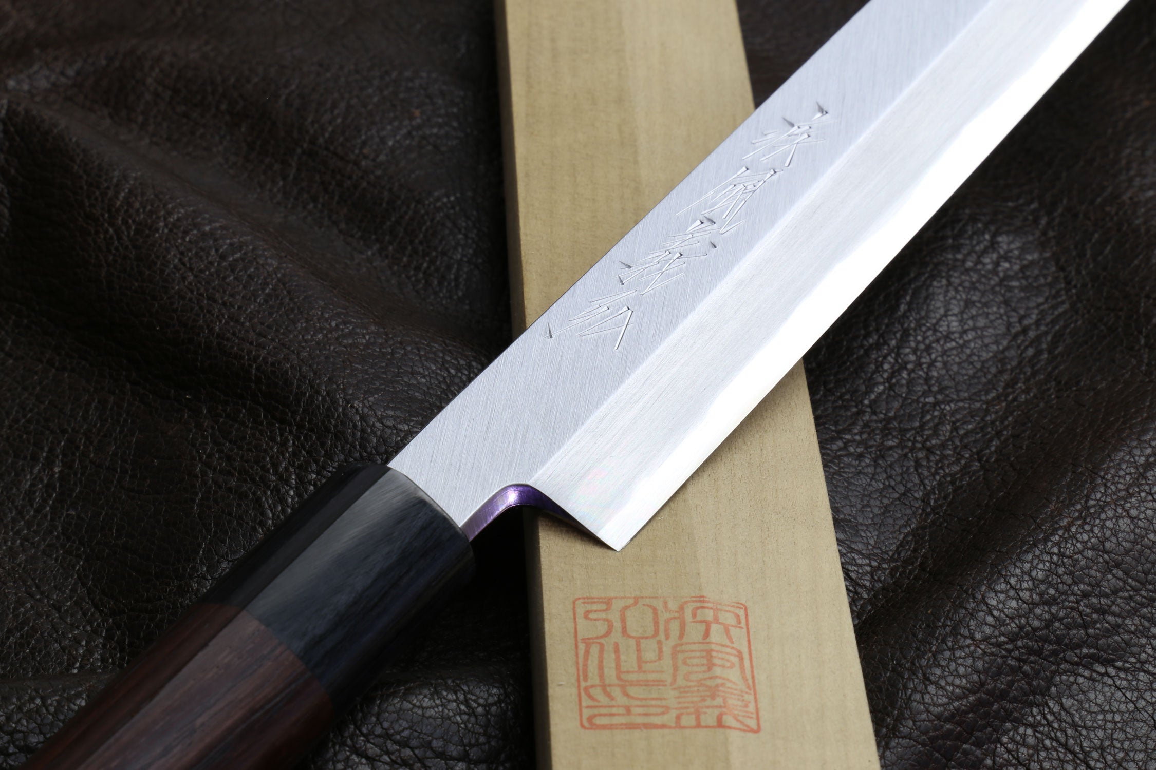 Japanese sushi knife with rosewood handle and pale wooden saya