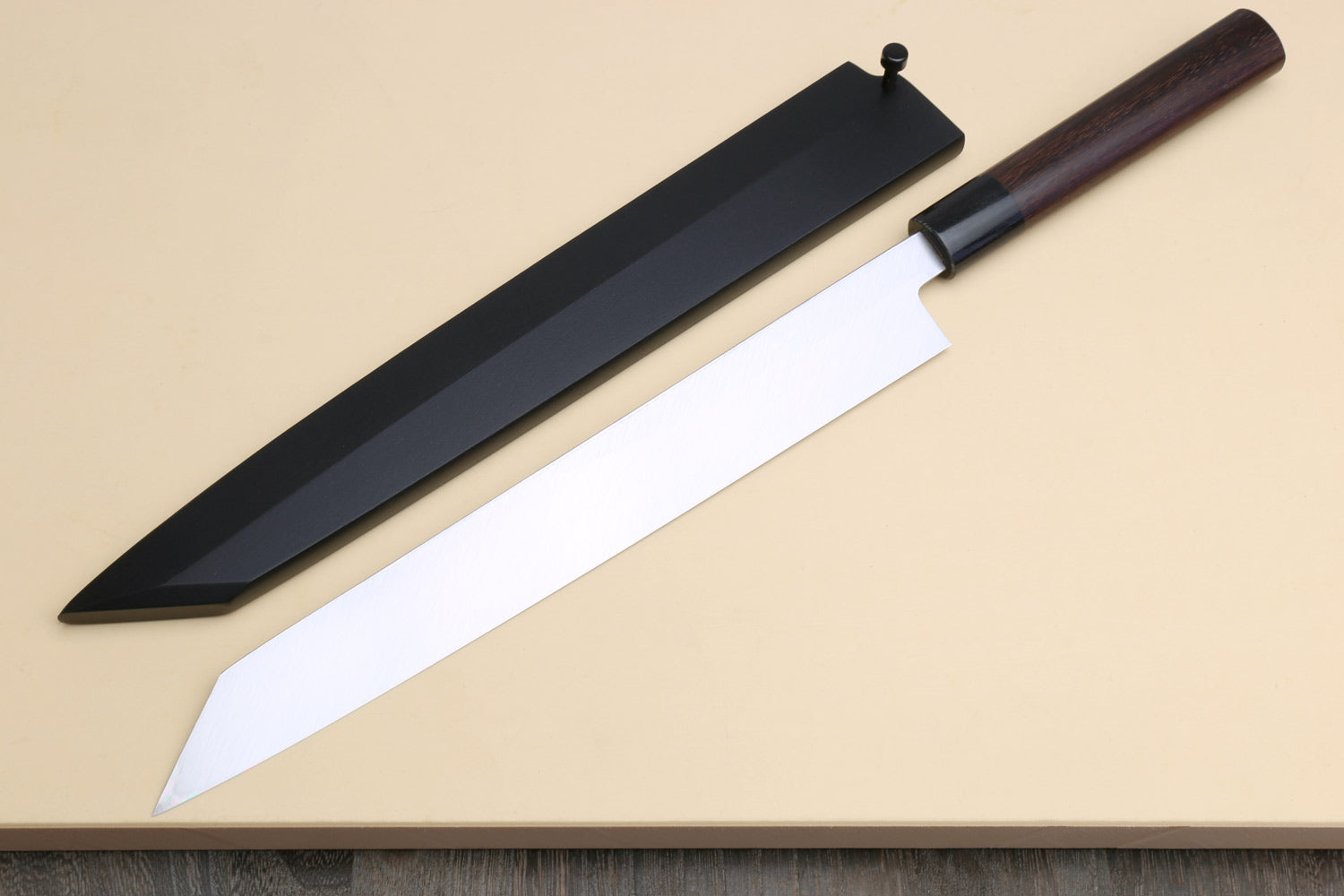 Yanagi-kiritsuke sushi knife with dark saya cover and white blade