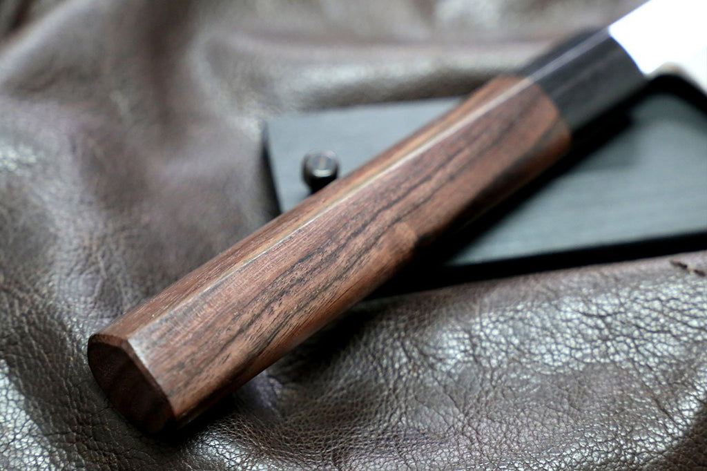 Rosewood knife handle with metal rivet