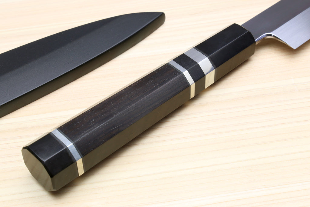 Yanagi sushi knife handle close-up with dark wood, silver rings, and black end cap