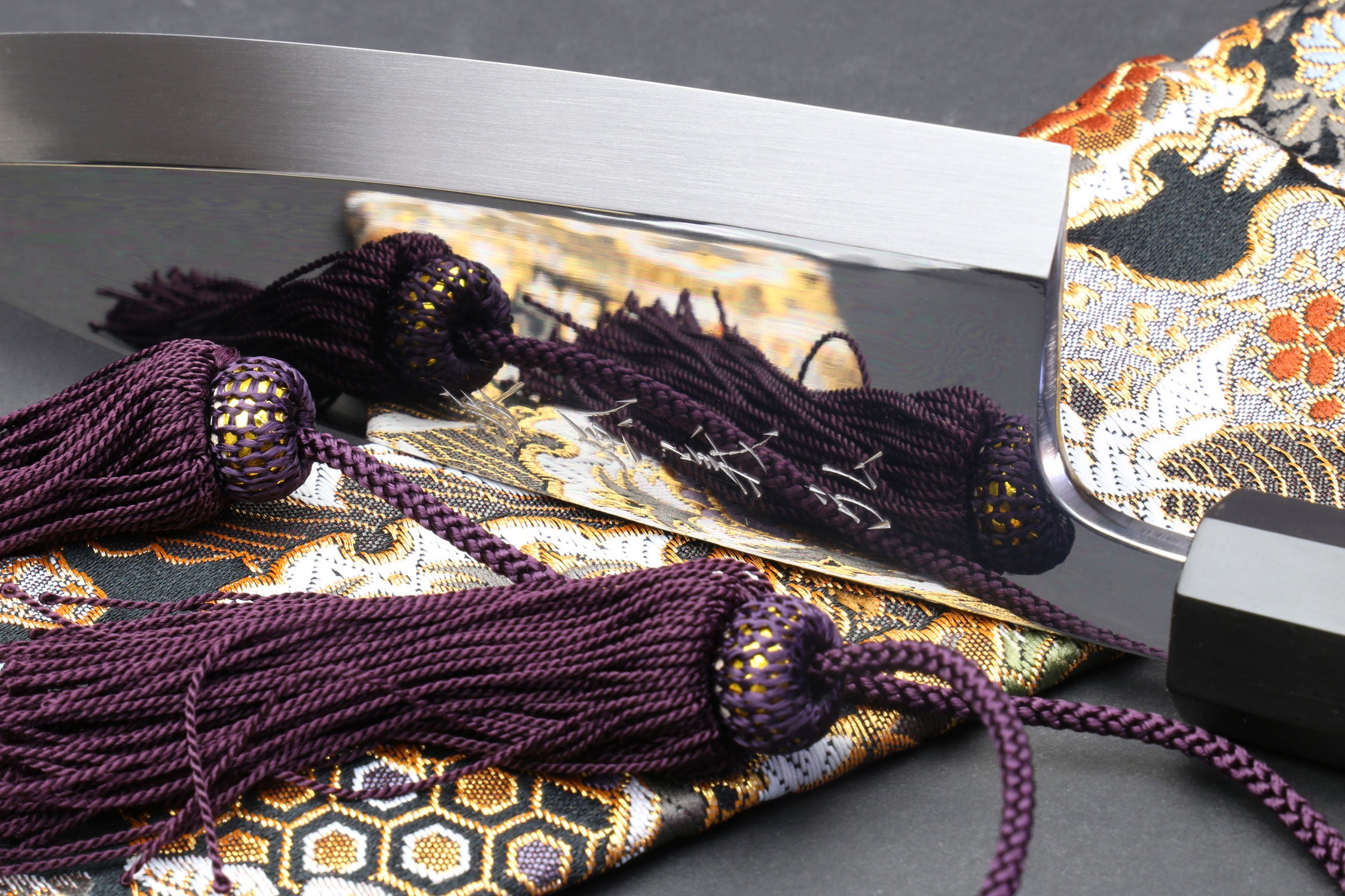 Deba sushi fillet knife, mirror blade with dark handle and purple braided cord