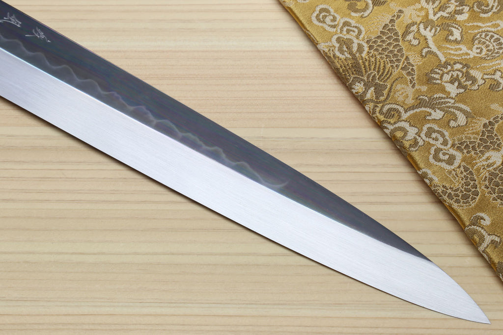 Japanese yanagiba sushi knife long mirror-finished blade with dark etched pattern near the spine