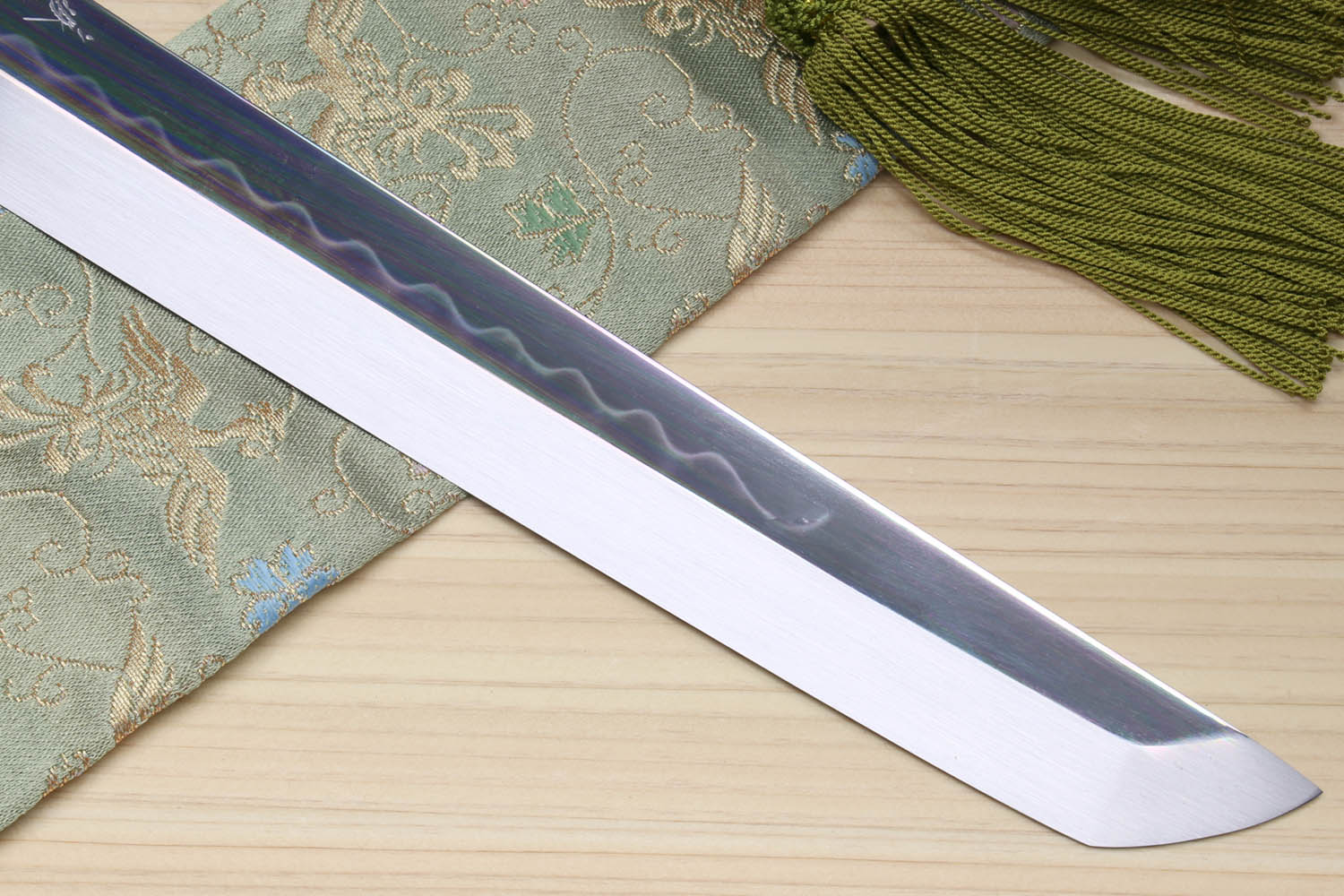 Japanese sushi knife with mirror silver blade and decorative wavy etched finish