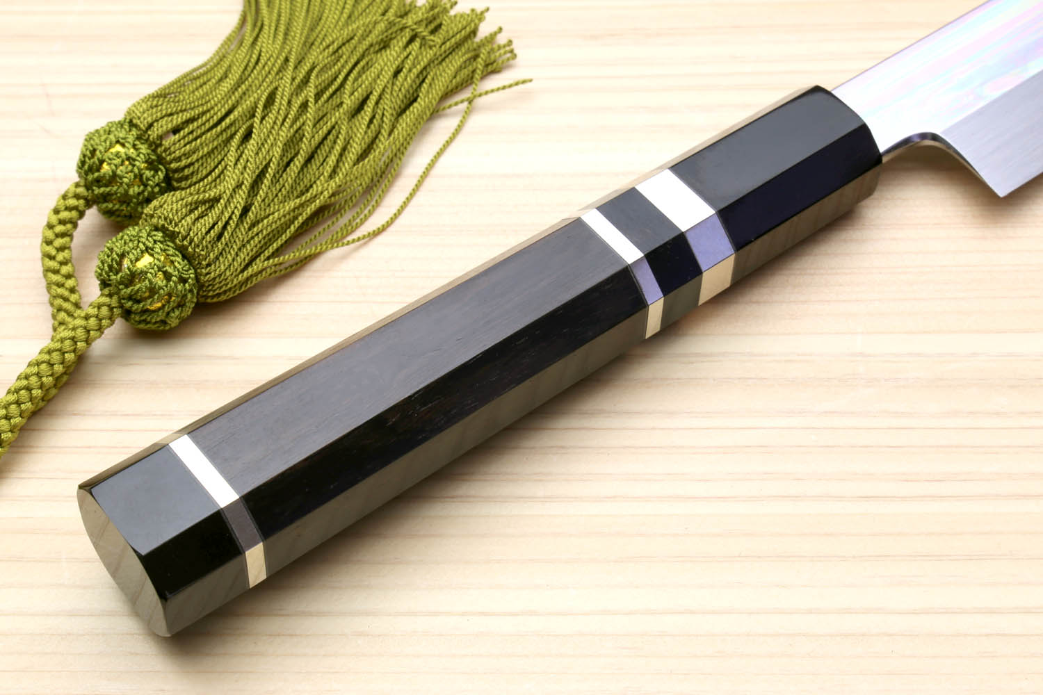 Japanese knife handle with black checkered bolster and mirror silver blade