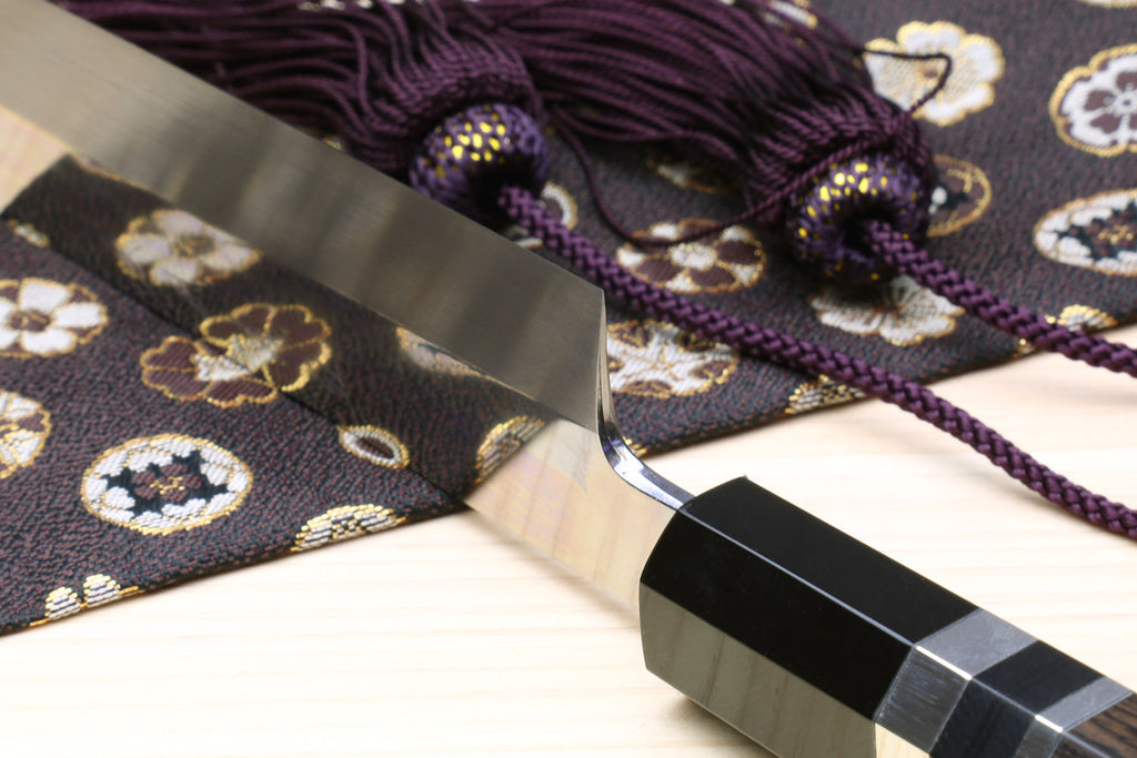 Yoshihiro Japanese sushi knife detail: mirror blade edge and ebony handle with silver rings