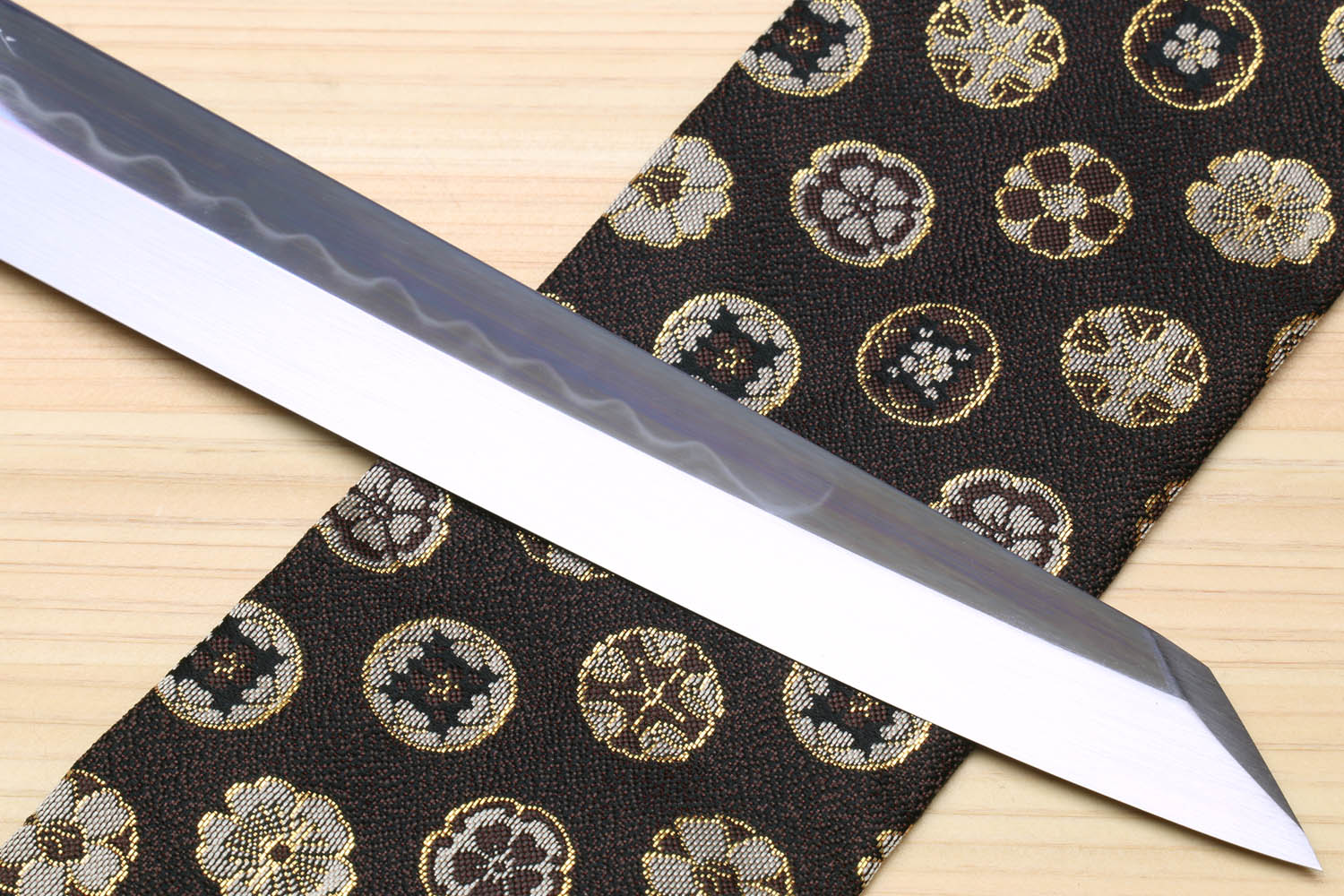 Yoshihiro Japanese sushi knife, mirror-finished blade with wavy hamon texture