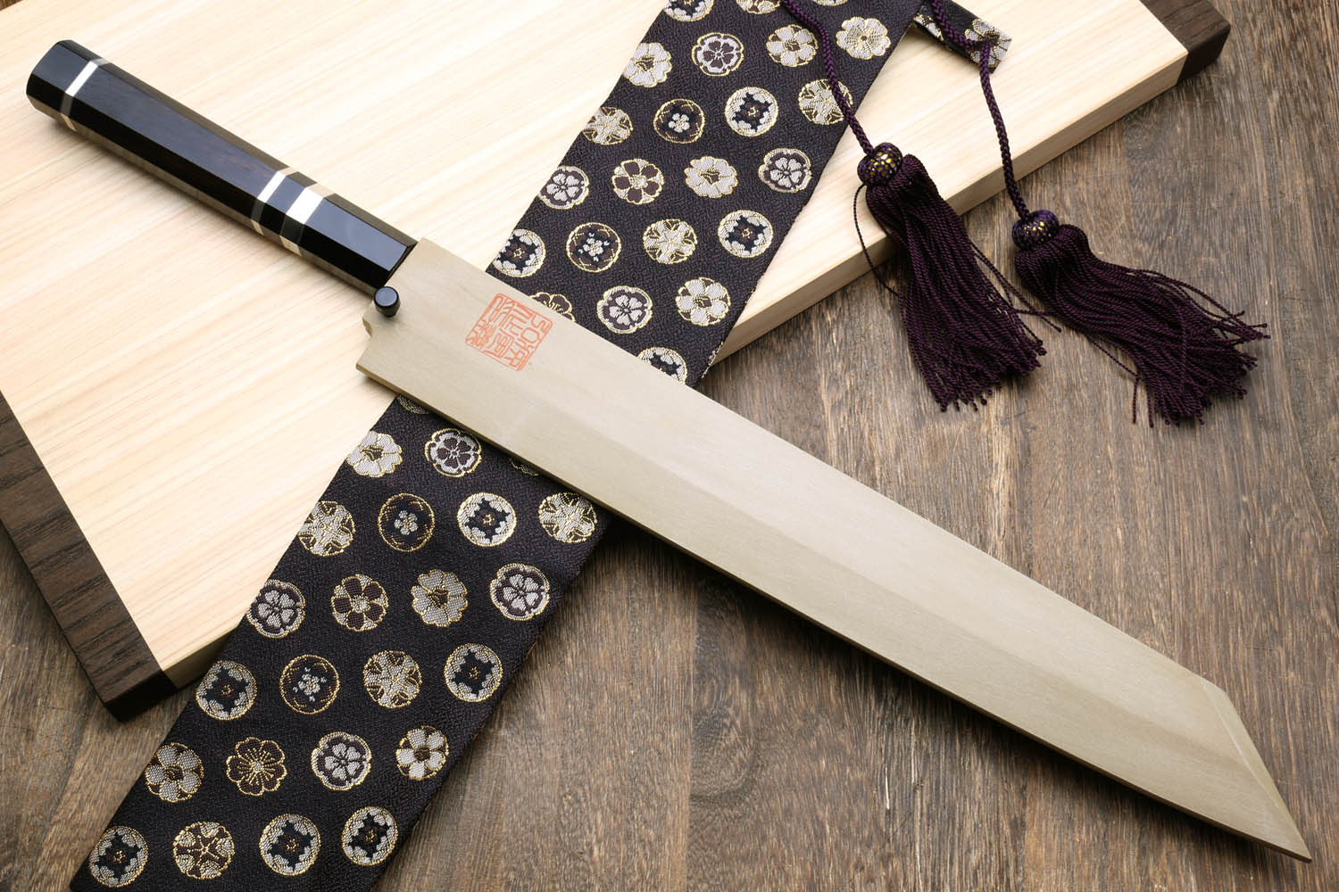 Yoshihiro Japanese sushi knife with mirror blade, ebony handle and patterned wrap cloth