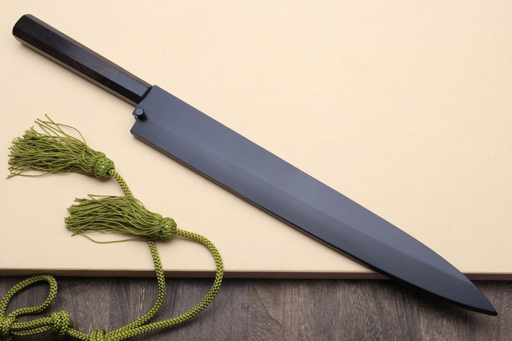 Yanagi knife in dark sheath with mirror blade tip, plus green cord tassels.