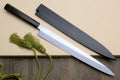 Yanagi knives in dark sheaths with mirror-finished blades and green cord tassels.
